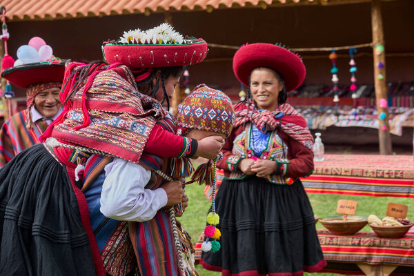  Dressed in their beautifully woven garments, the people of Chinchero come together in a joyful celebration of culture, heritage, and community.