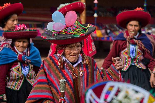 Dressed in their beautifully woven garments, the people of Chinchero come together in a joyful celebration of culture, heritage, and community.
