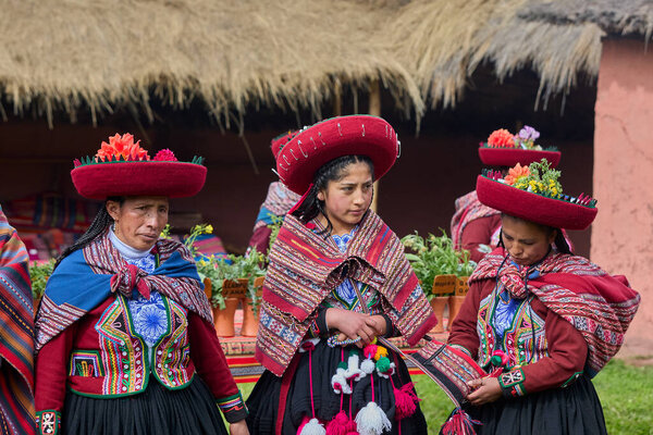 Dressed in their beautifully woven garments, the people of Chinchero come together in a joyful celebration of culture, heritage, and community.