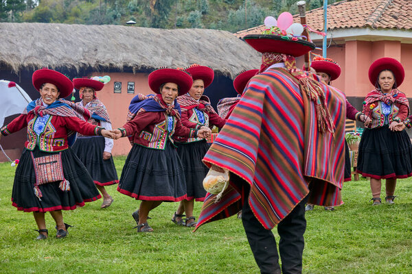 Dressed in their beautifully woven garments, the people of Chinchero come together in a joyful celebration of culture, heritage, and community.