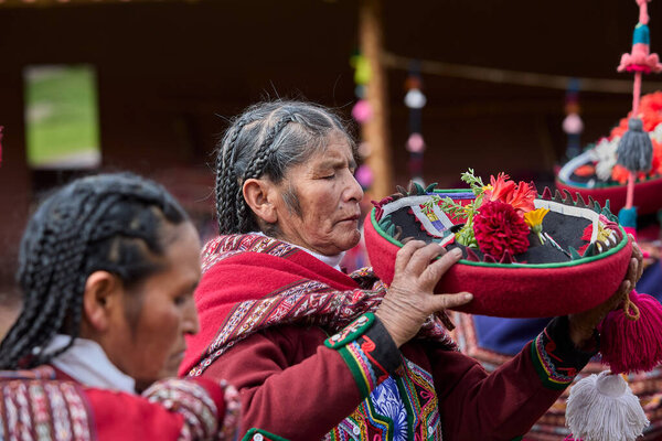 Dressed in their beautifully woven garments, the people of Chinchero come together in a joyful celebration of culture, heritage, and community.
