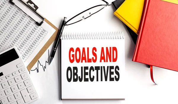Goals Objectives Text Notebook Clipboard Calculator White Background — Stock Photo, Image