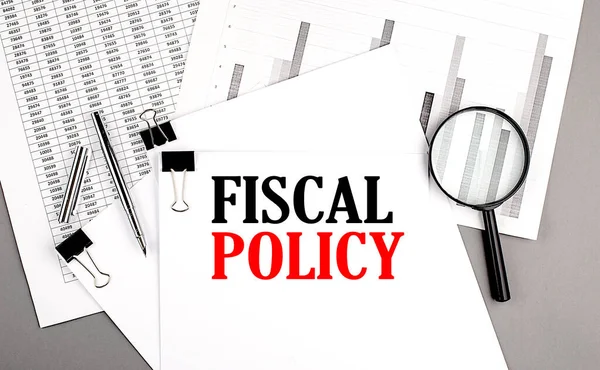 stock image FISCAL POLICY text on a paper on chart background