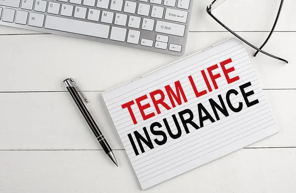 Term Life Insurance Text Notebook Keyboard Pen Glasses White Wooden — Stock Photo, Image