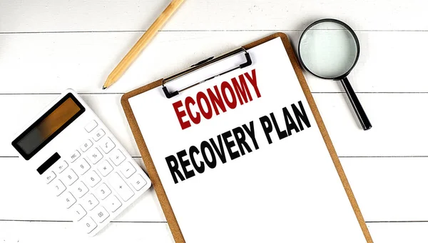Economy Recovery Plan Parole Blocco Appunti Con Calcolatrice Lente Ingrandimento — Foto Stock