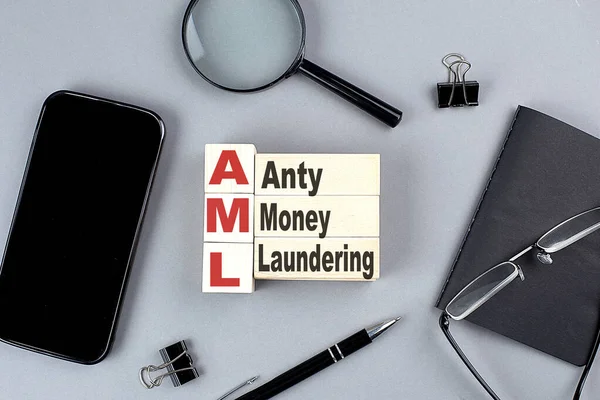 Wooden Cubes Aml Money Laundering Wtih Notebook Magnifier Smartphone Business — Stock Photo, Image