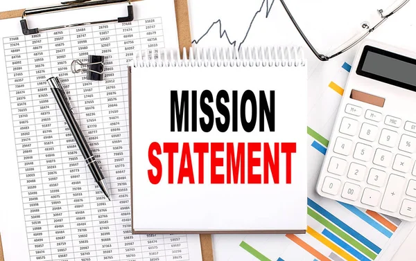 stock image Mission Statement text on a notebook with chart, calculator and pen