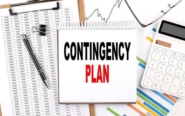 CONTINGENCY PLAN text on a notebook with chart, calculator and pen