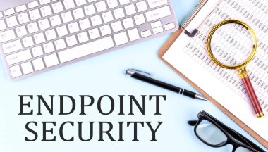 ENDPOINT SECURITY text on a blue background with keyboard and clipboard, business concept