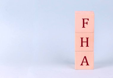 FHA on a wooden cubes on a blue background