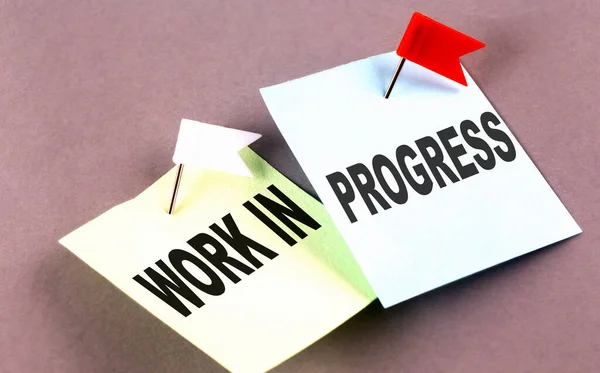 Work Progress Text Sticky Grey Background — Stock Photo, Image