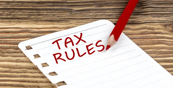 Palavras Tax Regras Sobre Papel Com Lápis Ping Sobre Fundo — Fotografia de Stock