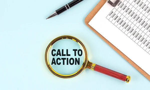 CALL TO ACTION text on a magnifier with clpboard on blue background