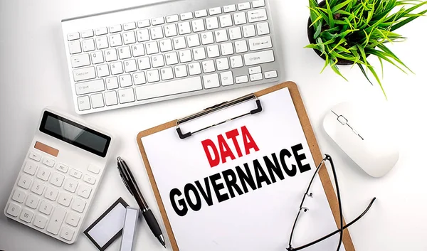 DATA GOVERNANCE text on a white paper. the inscription on the notebook