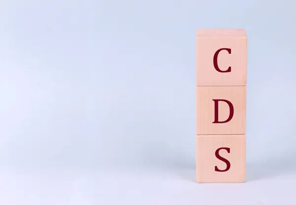 stock image CDS on a wooden cubes on a blue background