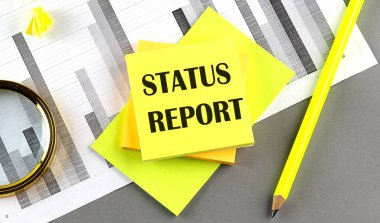 Çizelgedeki yapış yapış yapış bir metinde kalemi olan STATUS REPORT