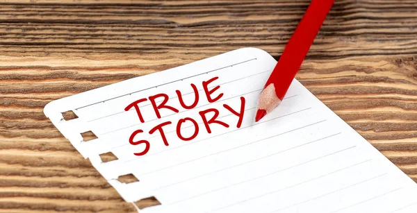 stock image Word TRUE STORY on paper with ped pencil on wooden background