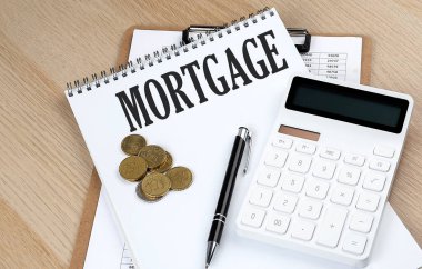 Grafikli, hesap makineli ve bozuk paralı MortGage metni, iş