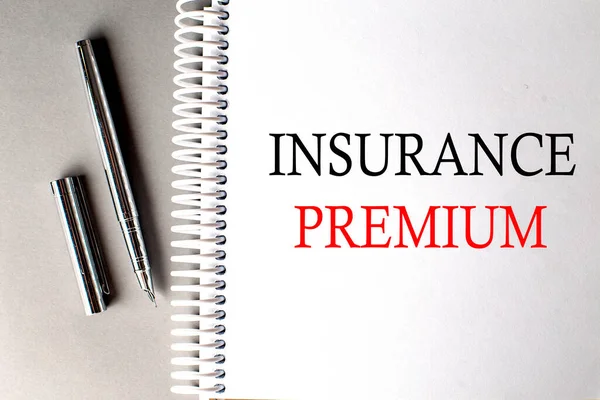 Insurance Premium Text Notebook Pen Grey Background — Stock Photo, Image