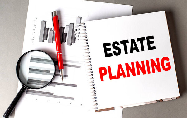 ESTATE PLANNING text written on a notebook with chart