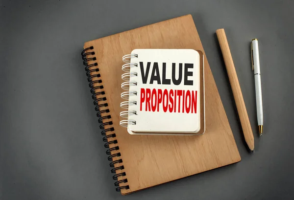 Value Proposition Text Notebook Pen Pencil Grey Background — Stock Photo, Image