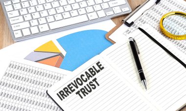 IRREVOCABLE TRUST text on a notebook with chart and keyboard clipart