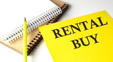 RENTAL OYUNU Not defteriyle sarı kağıda yazılmış metin