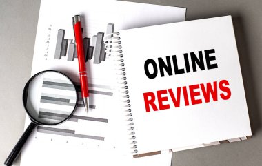 ONLINE REVIEWS text written on a notebook with chart clipart