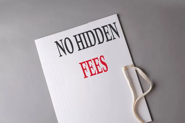 NO HIDDEN FEES text on a white folder on grey background
