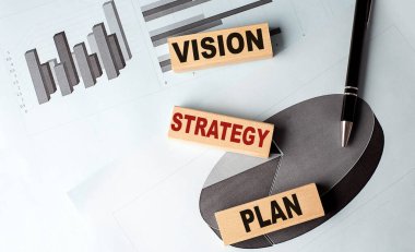 VISION STRATEGY PlanN tahta blok bir grafik arkaplan üzerinde