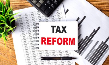 Çizelge ve hesap makineli dizüstü bilgisayarda vergilendirme reformu metni