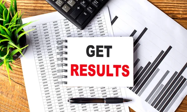 GET RESULTS text on notebook with chart and calculator