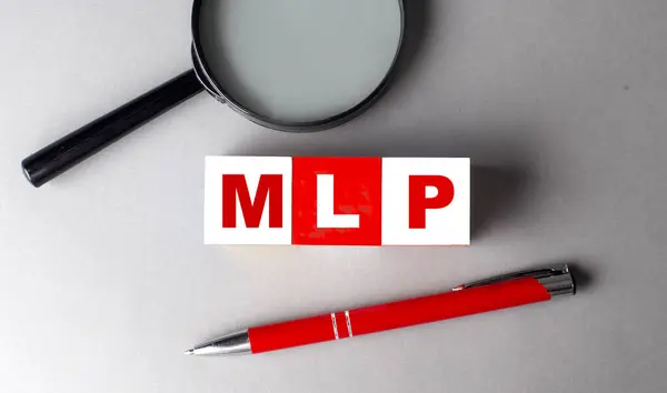 stock image MLP word on a wooden cubes with pen and magnifier