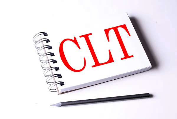 Text CLT on notebook on white background, business