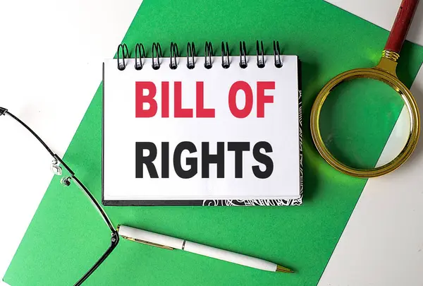 BILL OF RIGHTS text on a notebook on green paper