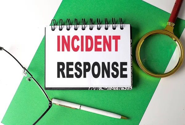 INCIDENT RESPONSE text on a notebook on green paper