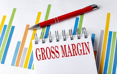 Not defterindeki GROSS MARGIN metni çizelgesi ve kalem iş konsepti
