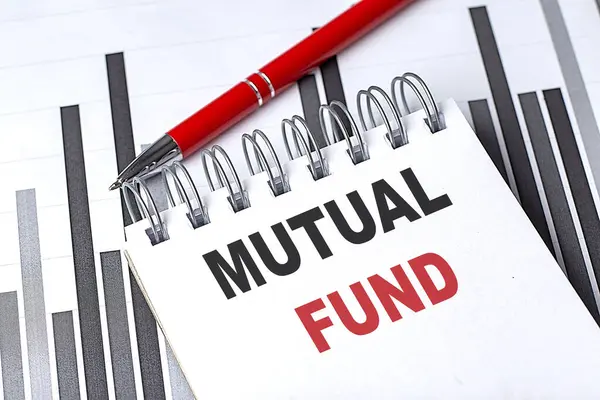 MUTUAL FUND text written on a notebook with pen on chart