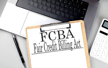 FCBA word on a clipboard on laptop with calculator and pen .  clipart
