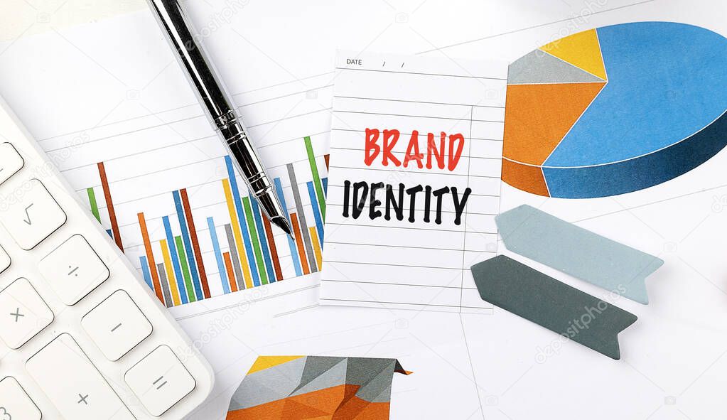 BRAND IDENTITY text on note paper on a chart background .