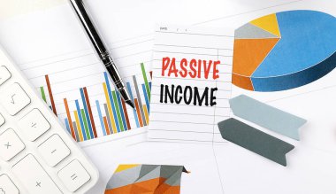 Passive income note with charts, pen, calculator, and sticky tabs on desk .  clipart