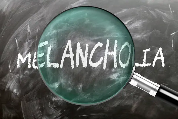 stock image Melancholia - learn, study and inspect it. Taking a closer look at melancholia. A magnifying glass enlarging word 'melancholia' written on a blackboard