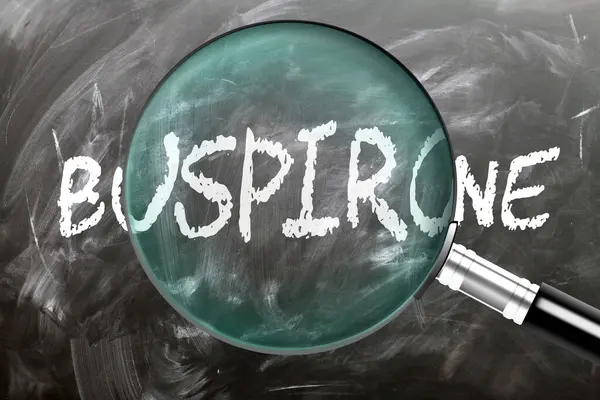 stock image Buspirone - learn, study and inspect it. Taking a closer look at buspirone. A magnifying glass enlarging word 'buspirone' written on a blackboard