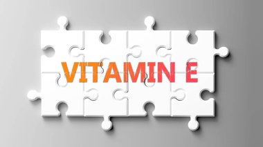 E vitamini kompleksi yapboz gibidir. E vitamini, yapboz parçalarının üzerinde E vitamini olarak resmedilir. E vitamini karmaşıktır..