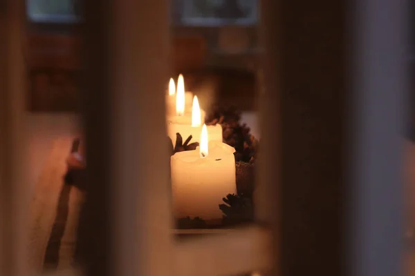 Christmas spirit, candle light and home decoration.