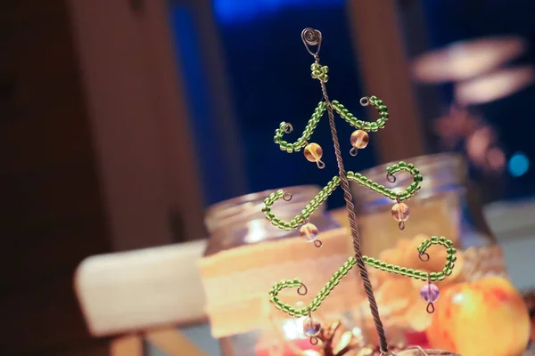 Green glass Christmas tree. Home decoration Bohemia mountains.