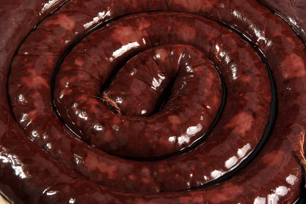 stock image Homemade natural blood sausage. Blood Sausage ring before cooking