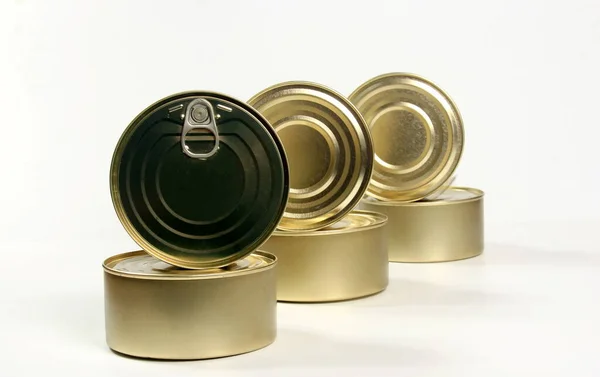 stock image Many closed tin cans on white and gray background. metal cans for fish and meat products