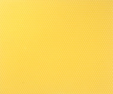 Bal peteğinin dokusu. Parlak sarı bal arkaplan. Bal hücreleri.