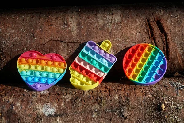 colorful antistress toys. Fidget toy set. Pop It sensory vector toy. Rainbow square popular pop it